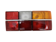 Volvo sedan 740, 760, 760,Tail light COMPLETE assembly with chrome center molding Right side/Passenger side 3518923