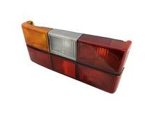 Volvo sedan taillight 240, 244, Tail light OPTICAL UNIT ONLY BLACK center molding Left side/Driver side 1372449 