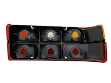 Volvo sedan taillight 240, 244, Tail light OPTICAL UNIT ONLY BLACK center molding Left side/Driver side 1372449 