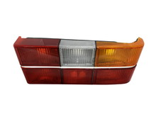 1372227 C Volvo sedan 240, 244, Tail light complete assembly with chrome center molding. Right side/Passenger side 